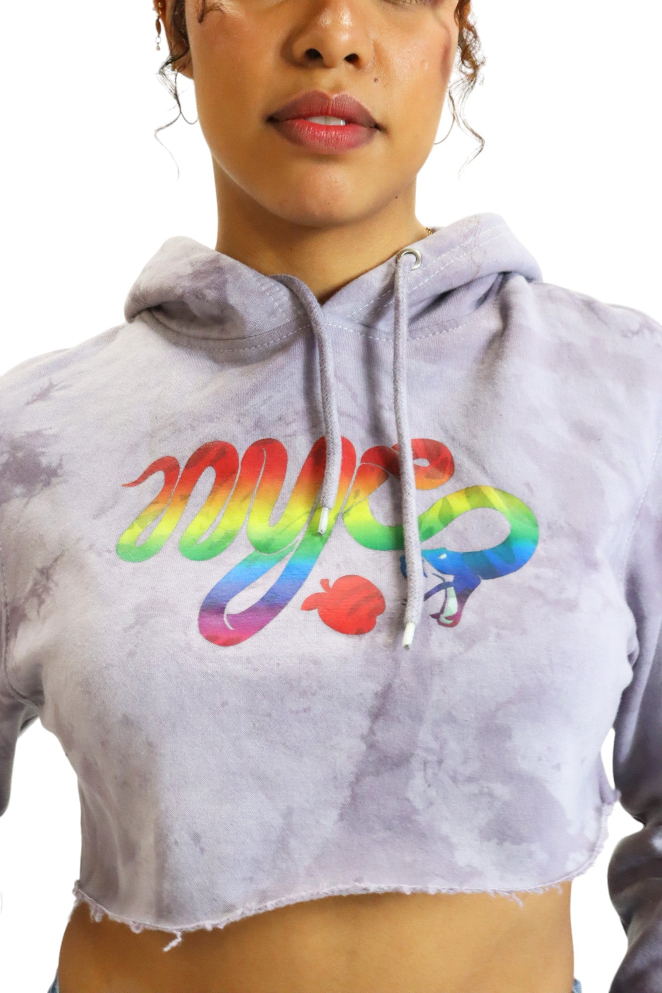 Close-up of the chest graphic on a lavender tie-dye hoodie, showing the 'nyc' serpent logo filled with a vibrant rainbow gradient.