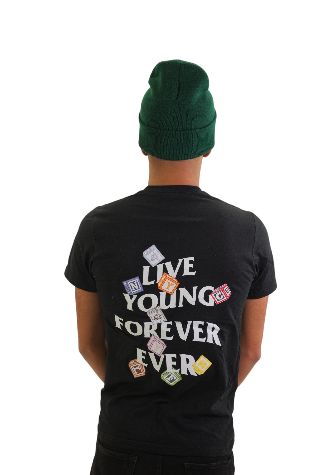Back view of a model wearing a black t-shirt. The back has a large graphic that reads 'LIVE YOUNG FOREVER EVER' with large, colorful alphabet blocks scattered around the text.