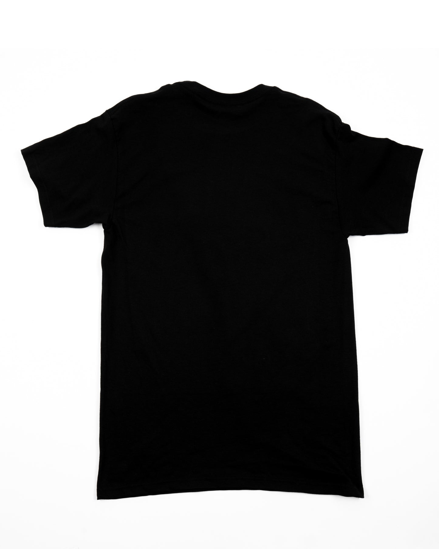 A plain black t-shirt laid flat, showing the blank back.