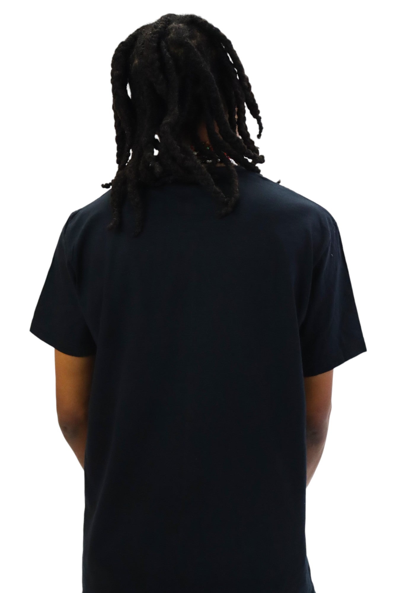 Back view of a model wearing a plain black t-shirt with no graphic.