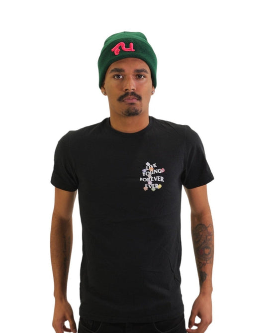 Front view of a model wearing a black t-shirt. On the left chest is a small logo that reads 'LIVE YOUNG FOREVER' surrounded by small, colorful alphabet blocks.
