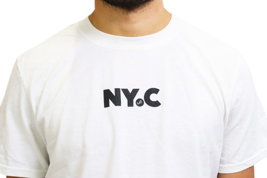 A man models a white t-shirt with black text that reads 'N.Y.C.'. On closer inspection, the periods within the logo contain a hidden 'MF' detail.