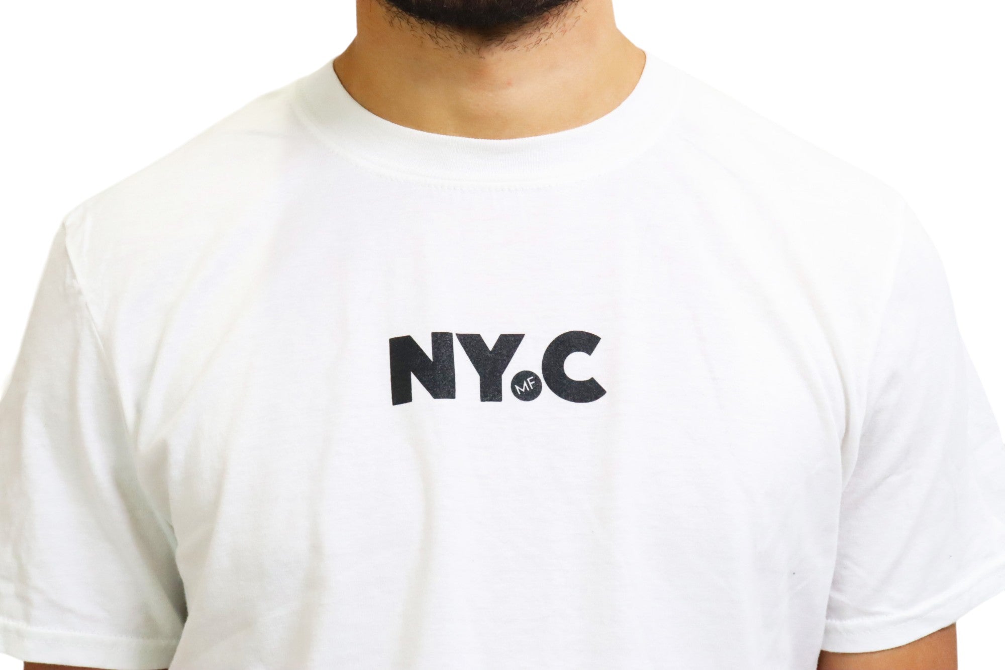 A man models a white t-shirt with black text that reads 'N.Y.C.'. On closer inspection, the periods within the logo contain a hidden 'MF' detail.
