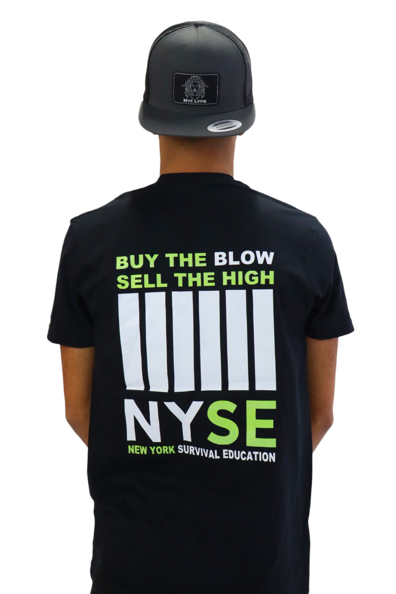 Back view of a model wearing a black t-shirt with a large graphic. In neon green text it reads 'BUY THE BLOW SELL THE HIGH' above a stylized white bar code and the acronym 'NYSE', which stands for 'New York Survival Education'.