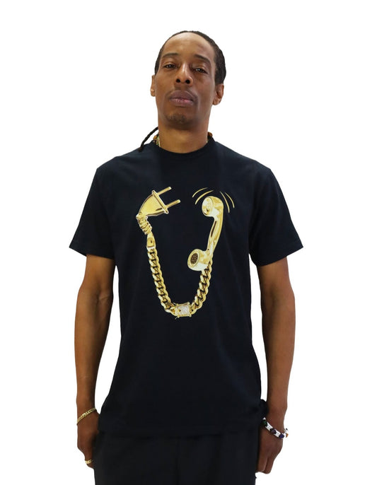Front view of a model wearing a black t-shirt. The shirt features a large graphic of a golden telephone handset, where the cord is a diamond-encrusted gold Cuban link chain leading to a disconnected electrical plug.